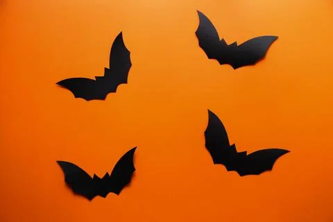 Bats on an orange background Stock Photos