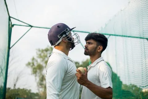 Batsman is angry with the bowler while playing cricket. Stock Photos