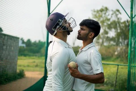 Batsman is angry with the bowler while playing cricket. Stock Photos