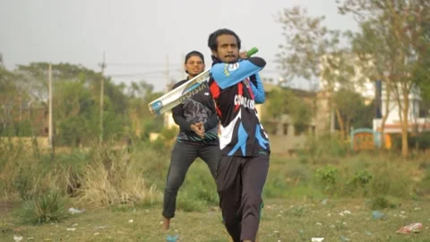Batsman get ready and face the ball in local cricket game Stock Footage 293939714