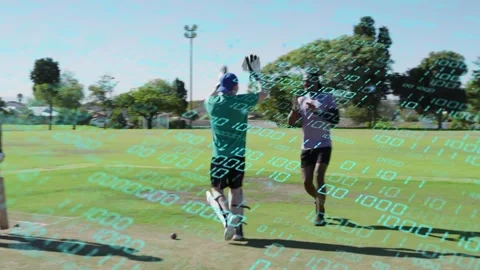 Batsman hitting ball sparking keeper diving and team chasing under binary sports Stock Footage 333837844
