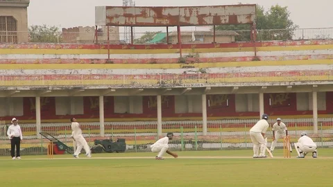 Batsman playing stroke and taking runs Stock Footage 86599281