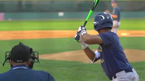 A batter at a baseball game prepares to swing the bat and hit the ball, slow mot Stock Footage 68577369