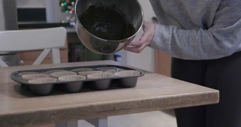 Batter Being Poured into Cupcake Pan Stock Footage 142151692