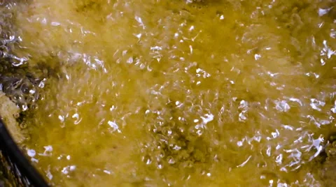 Batter-fried chicken meat nuggets are all deep fried well done in hot boiling Stock Footage 66784156