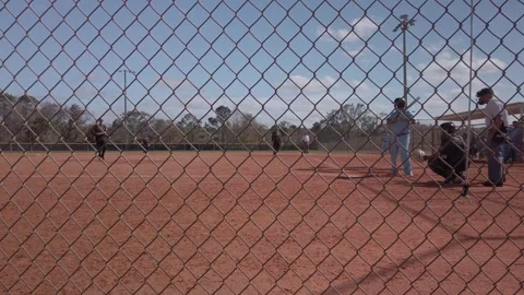 Batter hits and grounds out. USA Softball Mens WINTER Classic Stock Footage 263094218