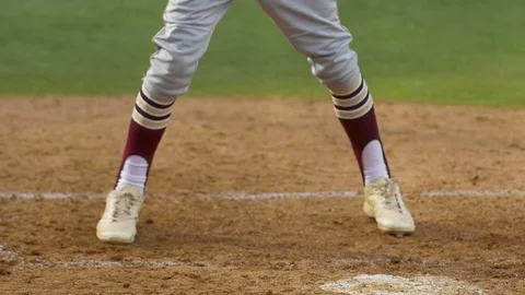 A batter makes a play at a baseball game, slow motion. Stock Footage