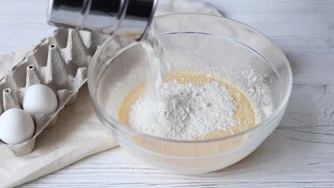 Batter preparation process, adding flour to beaten eggs Stock Footage 151511750