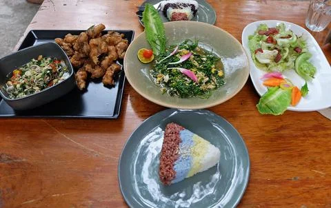 Battered and deep fried fish with herb sauce, Stir fry Malindjo leaves with eggs Stock Photos