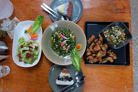 Battered and deep fried fish with herb sauce, Stir fry Malindjo leaves with eggs Stock Photos