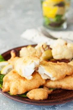 Battered fish with cauliflower Stock Photos
