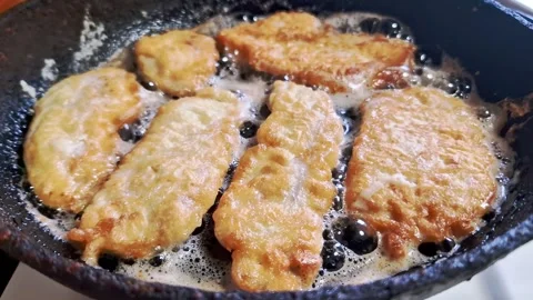 Battered Fish Fillets Frying in Hot Bubbling Oil Stock Footage 321961876
