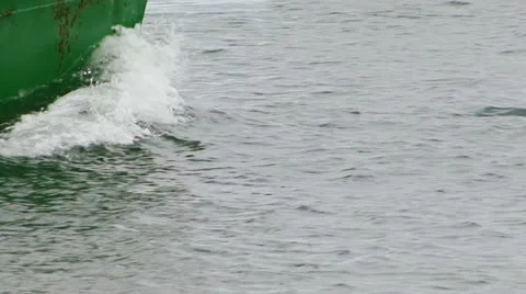 Battered Hull Bow Wave Green Boat  Stock Footage 11081584