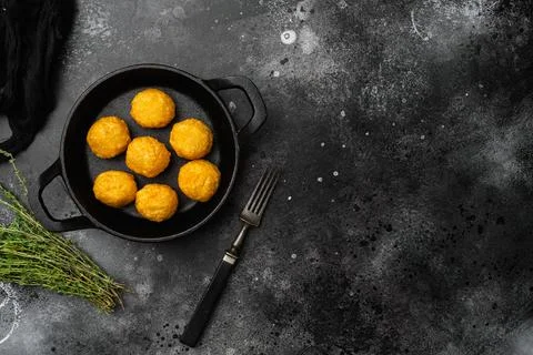 Battered meat on black dark stone table background, top view flat lay, with copy Foto stock