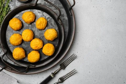 Battered meat on gray stone table background, top view flat lay, with copy space Stock Photos