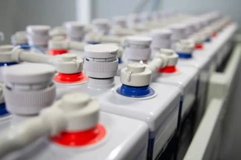 Batteries direct current in row. DC battery. Stock Photos