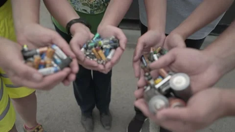 Batteries in the hands of the people Stock Footage 137098398