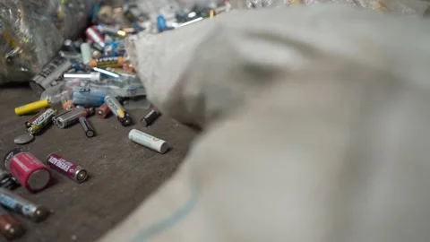 Batteries in a special container for garbage collection Stock Footage 137101967