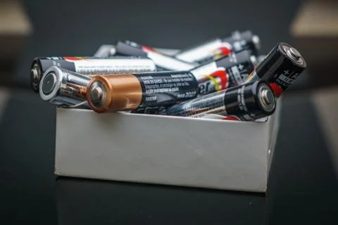 Batteries on a white box Stock Photos