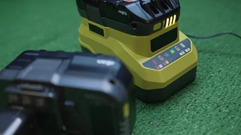Battery and charger for tools with charge level indicator Stock Footage 333957010