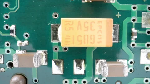 The battery and transistors on the circuit board Stock Footage 137356562
