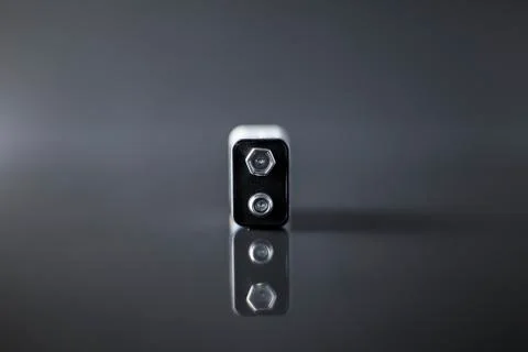 Battery on a black background with reflection on glass Foto stock