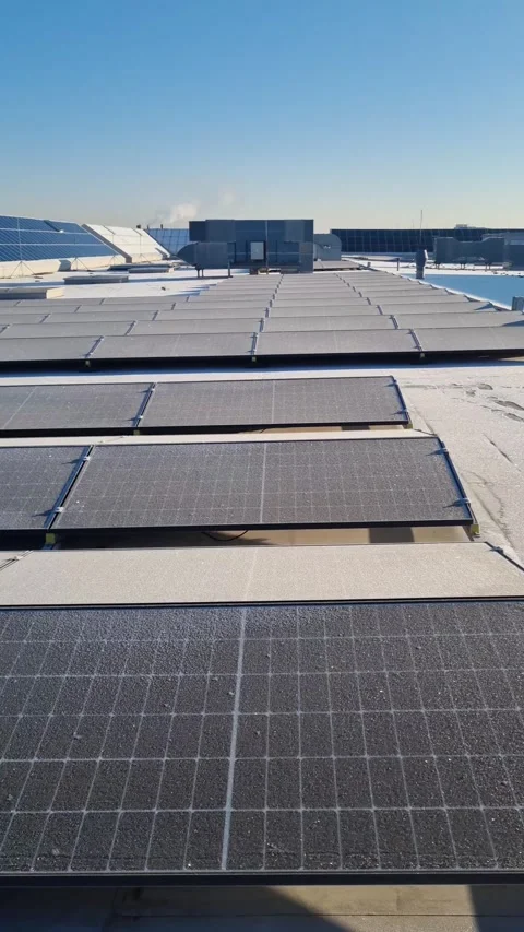 The battery is charged from a solar cell in winter. Green energy concept Video stock 265799355