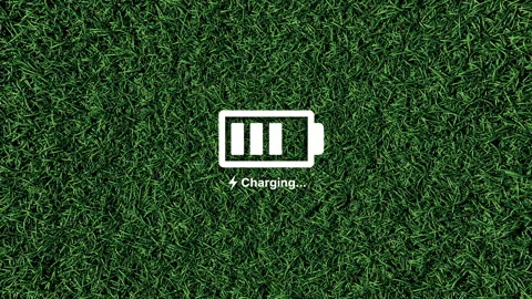 Battery charging line by line on grass background animation. Stock Footage 334959617
