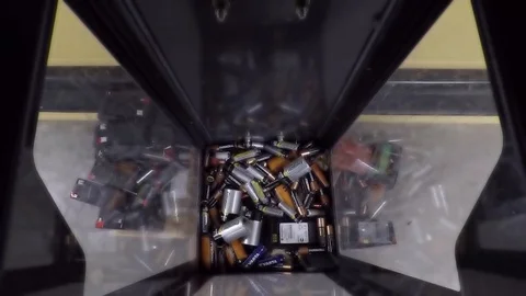 Battery disposal bin with various batteries Stock Footage 118919353