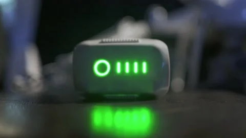The battery from the drone is being charged Stock Footage 145644371