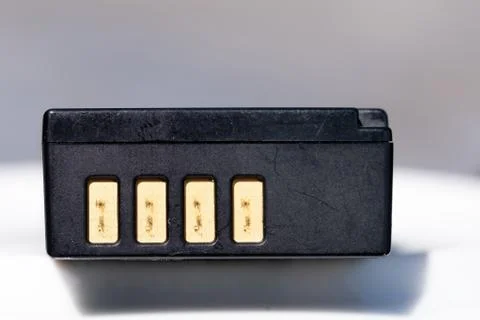 Battery for DSLR or system camera. Rechargeable on white with gray background Foto stock