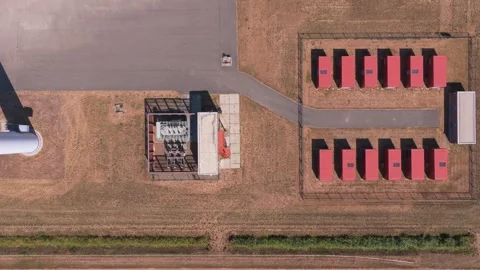 Battery energy storage system facility with large red containers storing Stock Footage 345027115