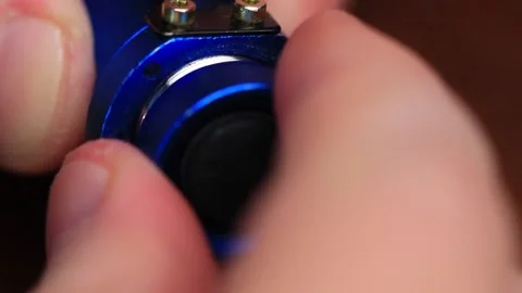 The Battery Fits into the Flashlight Stock Footage 256099756