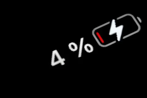 Battery level indicator charging process - white pixel number - four, 4 percent Stock Photos