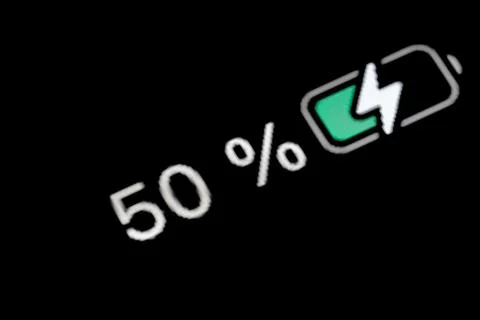 Battery level indicator charging process - white number - fifty, 50 percent Stock Photos