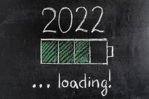 Battery loading indicator showing 2022 loading drawn on chalkboard. New year  Stock Photos