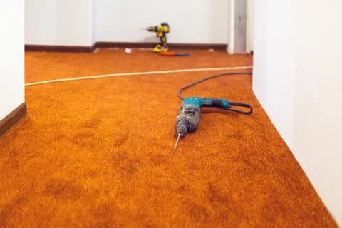 Battery screwdriver and electrical drill - are construction hand  tools  for ho Stock Photos