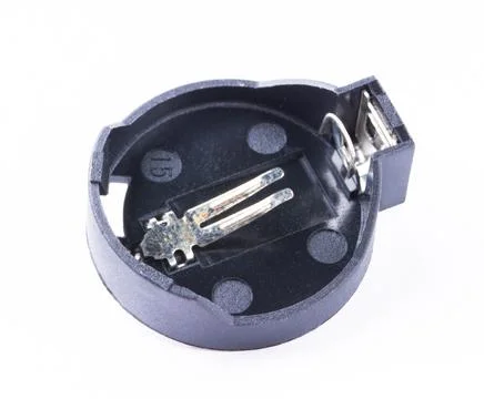 Battery socket - cover for small button batteries isolated on white background. Stock Photos