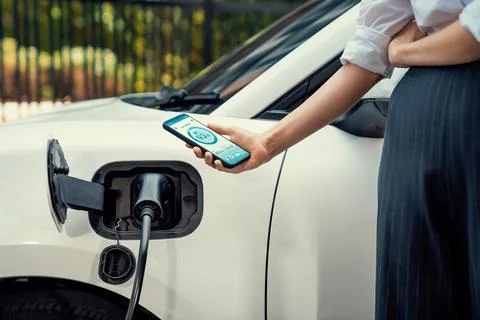 Battery status interface on smartphone for progressive future refueling concept. Stock Photos