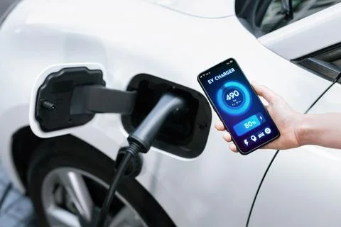 Battery status interface on smartphone for progressive future refueling concept. Stock Photos