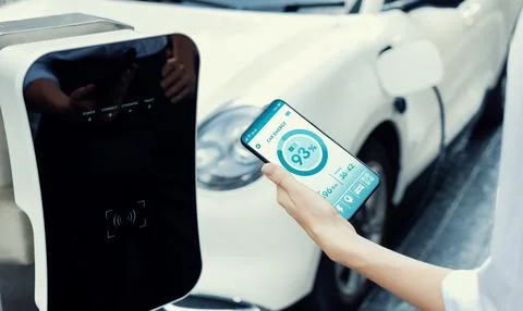 Battery status interface on smartphone for progressive future refueling concept. Stock Photos