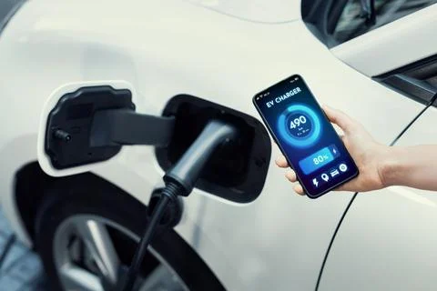 Battery status interface on smartphone for progressive future refueling concept. Stock Photos