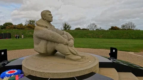 The Battle of Britain Memorial at Capel-le-Ferne Statue of an Airman Stock Footage 219687577