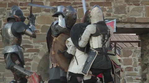Battle knights in armor in the castle during the day Stock Footage 53287598