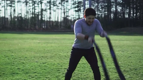 Battle Rope Training In A Field, Man Stock Footage 159763854