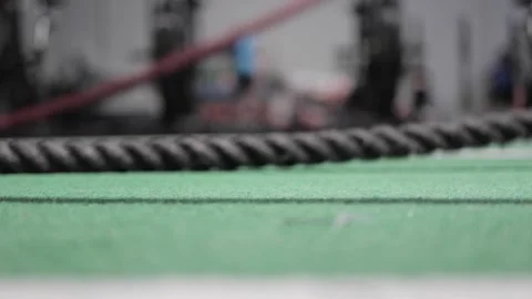 Battle ropes slam into ground in close up slow-motion shot  Stock Footage 240399401