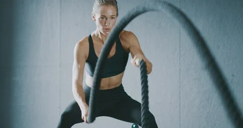 Battle roping like it's her job Stock Footage 123573285