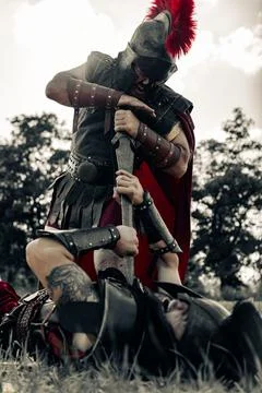 Battle with swords between two ancient warriors. Stock Photos