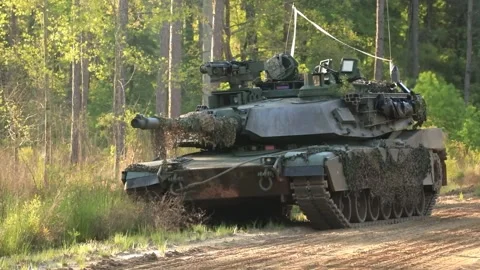 Battle tank turret oscillating while parked in woodland Stock Footage 271338539