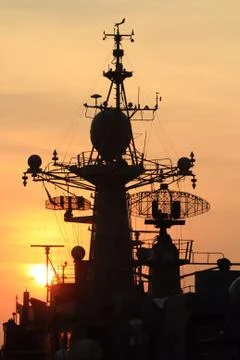 Battleship with sunset behind Foto stock